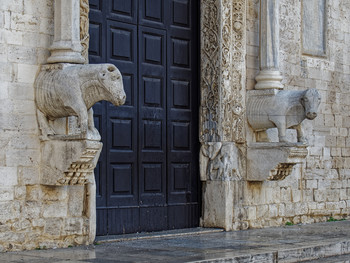 Bulls guarding the entrance to the Church of St. Nicholas.