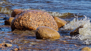 The play of sun and shadows on water and rocks.