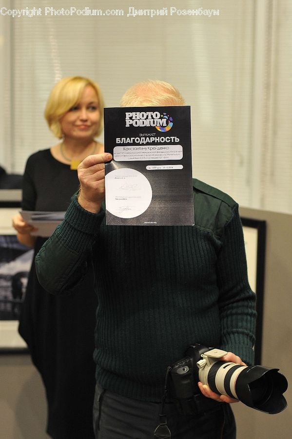 People, Person, Human, Business Card, Paper, Text, Camera