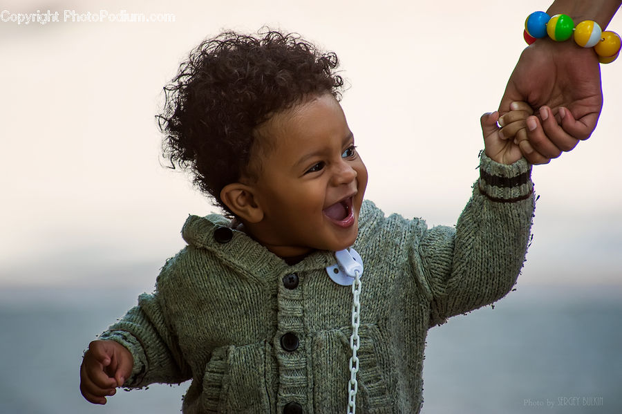 People, Person, Human, Cardigan, Clothing, Sweater, Afro Hairstyle