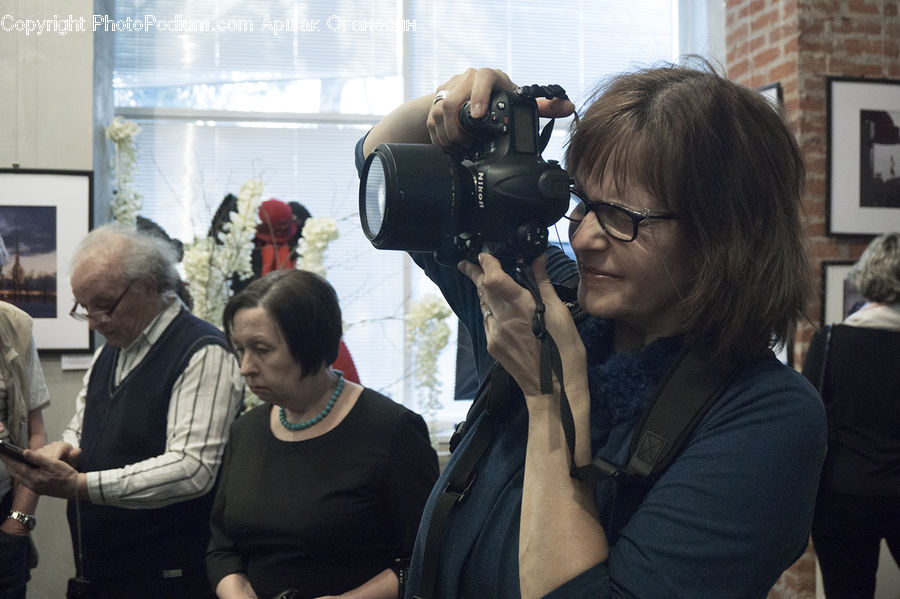 Human, People, Person, Plant, Potted Plant, Camera, Electronics