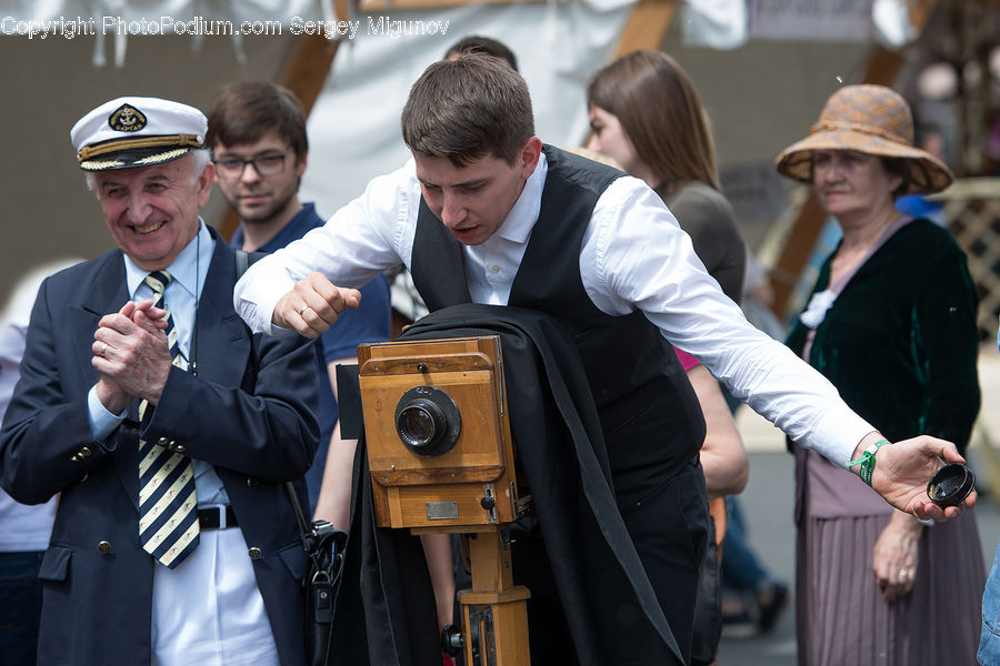 People, Person, Human, Camera, Electronics, Crowd, Coat