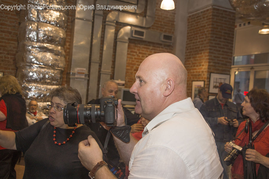 People, Person, Human, Camera, Electronics, Digital Camera, Apparel