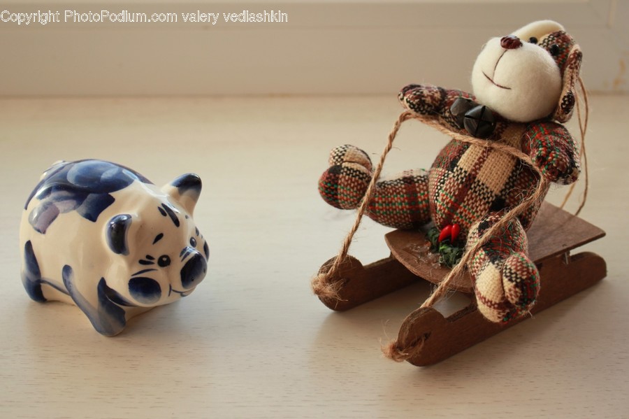 Figurine, Wood, Toy, Apparel, Helmet