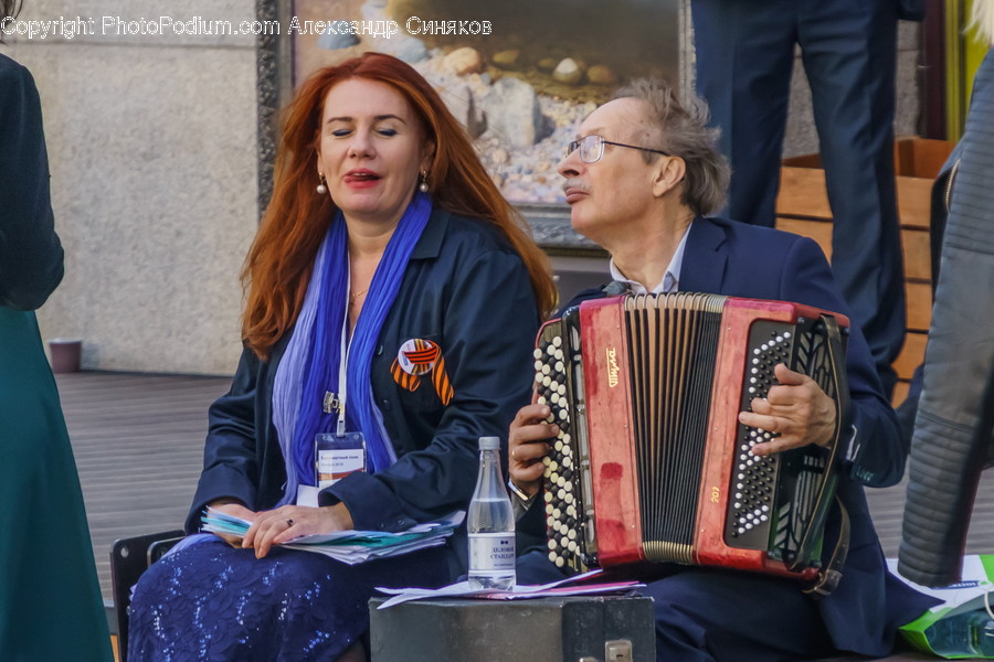 Person, Human, Musical Instrument, Sitting, Accordion
