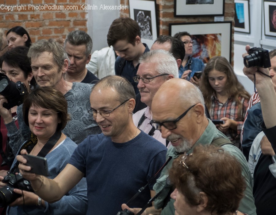 Person, Human, Camera, Electronics, Sitting