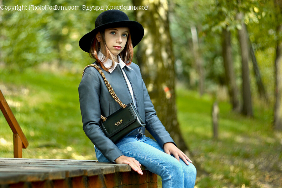 Clothing, Pants, Hat, Person, Sitting