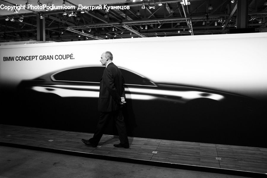 People, Person, Human, Clothing, Overcoat, Suit, Transportation