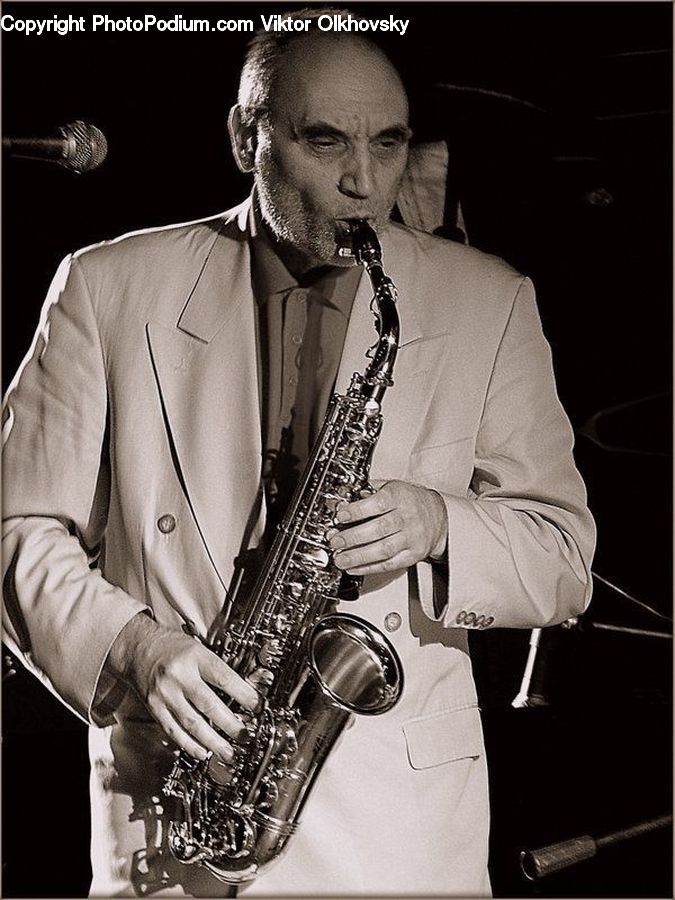 People, Person, Human, Musical Instrument, Saxophone, Paper, Paper Towel