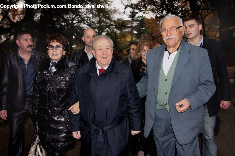 People, Person, Human, Clothing, Overcoat, Suit, Coat